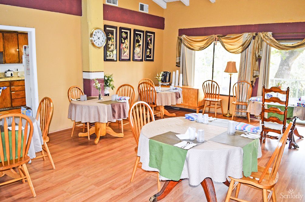 An inviting restaurant dining area with neatly arranged tables and chairs.
