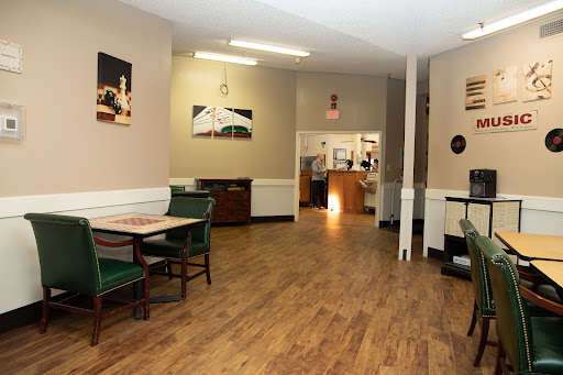 A view of the restaurant's interior featuring tables and chairs in a casual dining setting.