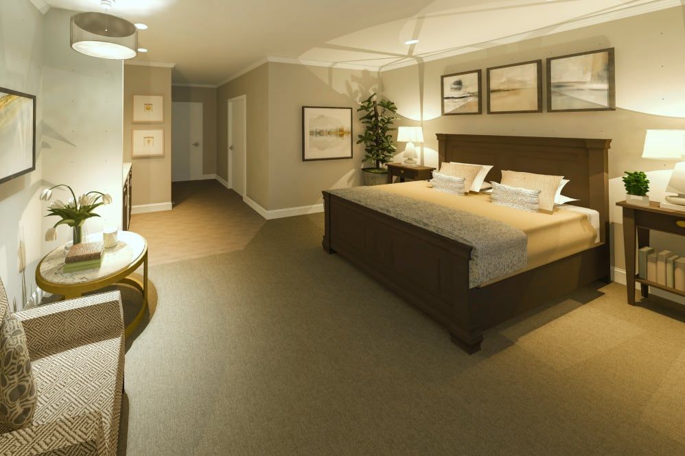A spacious bedroom with elegant furnishings and neutral-toned decor.