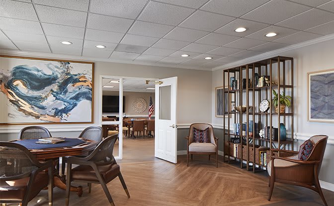 A modern office interior with a meeting area and stylish decor.