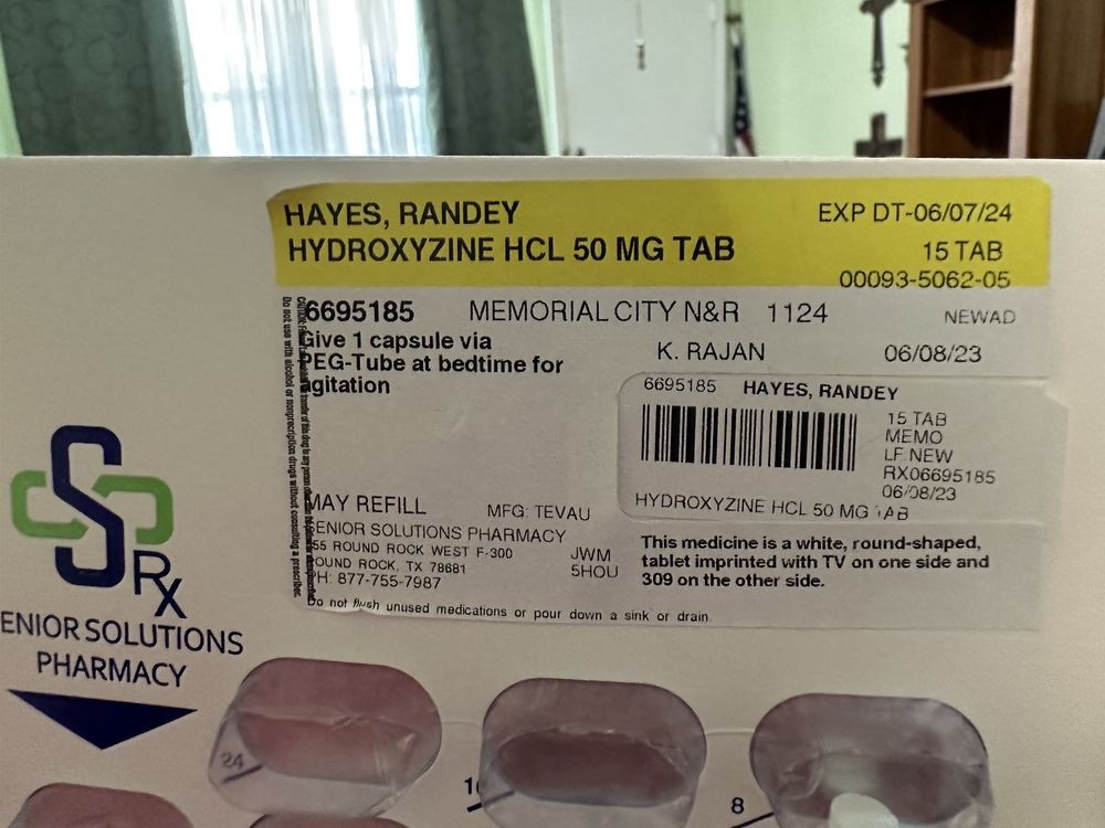 A prescription label for Hydroxyzine HCl 50 mg tablets from a pharmacy.