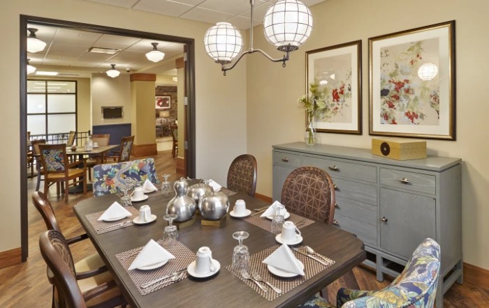 A well-set dining table in a cozy and elegantly decorated dining room.