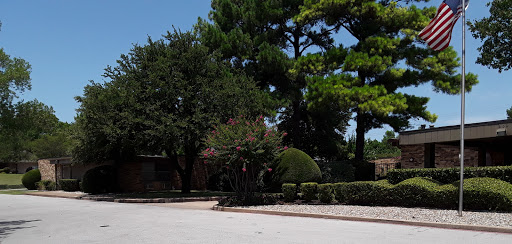 A serene outdoor scene featuring lush trees and a well-maintained landscape.