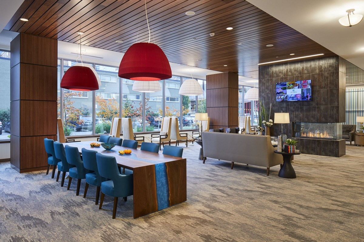 A modern lobby with comfortable seating and stylish lighting fixtures.