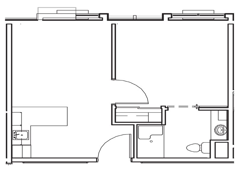 A simple floor plan showing the layout of an apartment with a kitchen, bathroom, and living area.