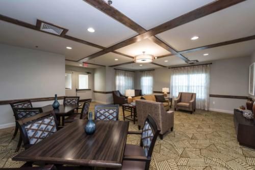 A modern interior room with comfortable seating and decorative lighting.