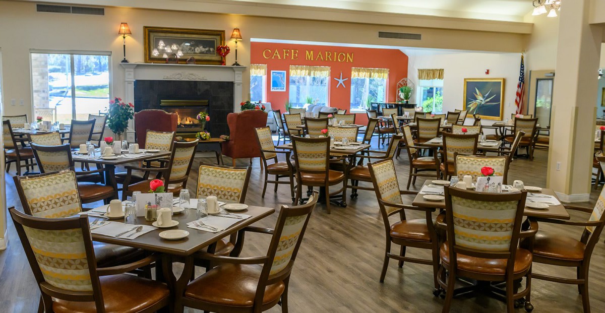 A cozy dining area with neatly arranged tables and chairs, ready for service.