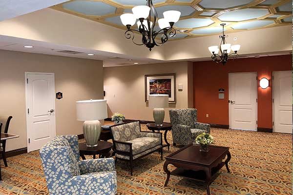 A hotel lobby with comfortable seating and elegant lighting.