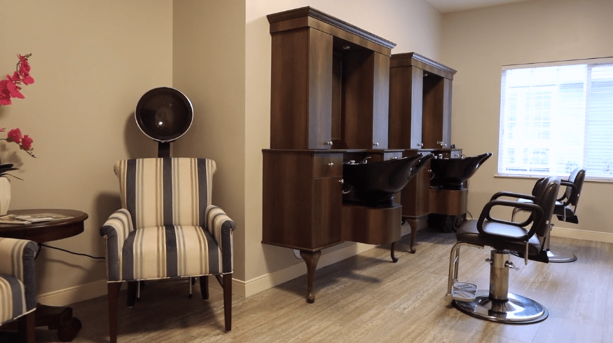 A stylish hair salon interior featuring washing stations and seating area.
