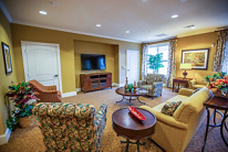A cozy living room with comfortable seating and a TV.