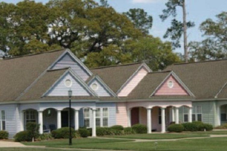 Colorful houses with porches in a residential neighborhood.