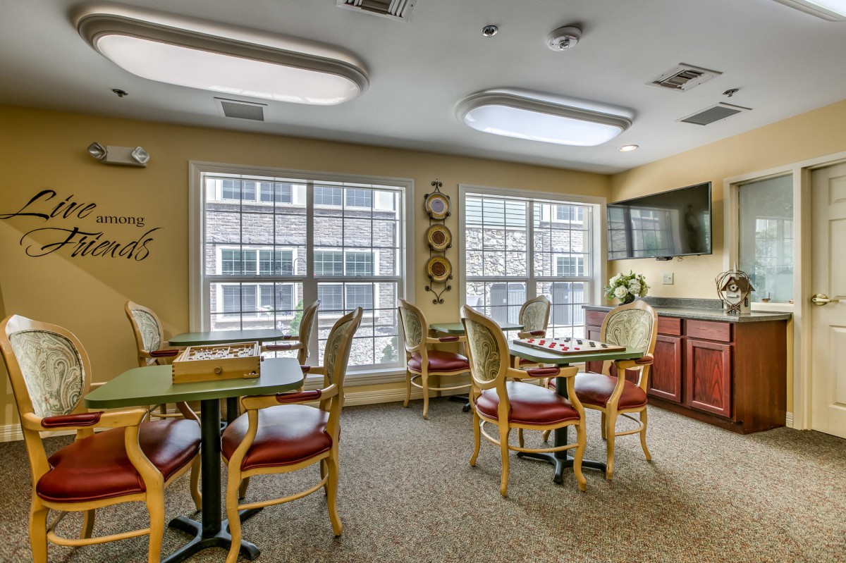 A cozy dining area with elegant furniture and natural lighting.