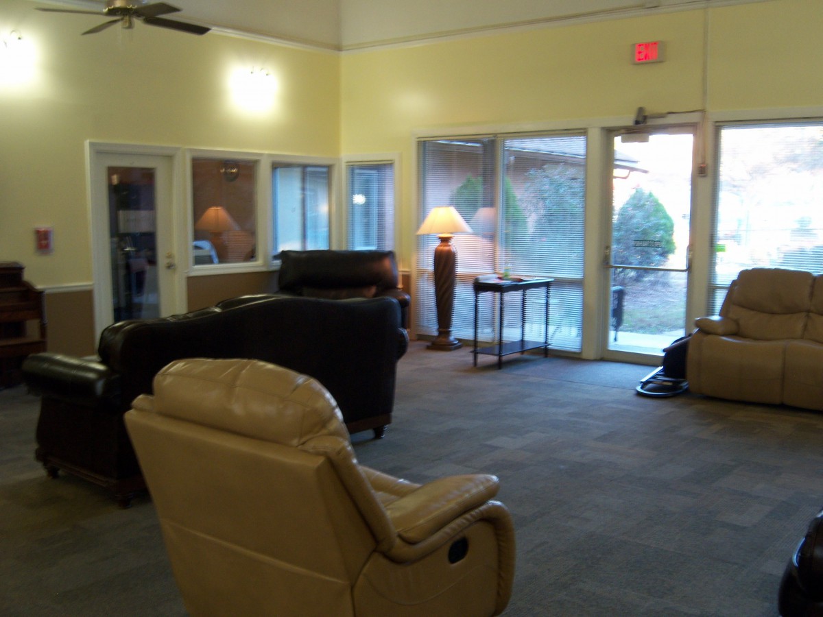 A cozy lobby area with comfortable seating and warm lighting.