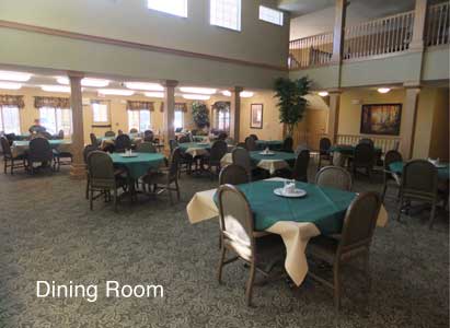 A spacious dining room with neatly arranged tables and chairs, welcoming for communal meals.