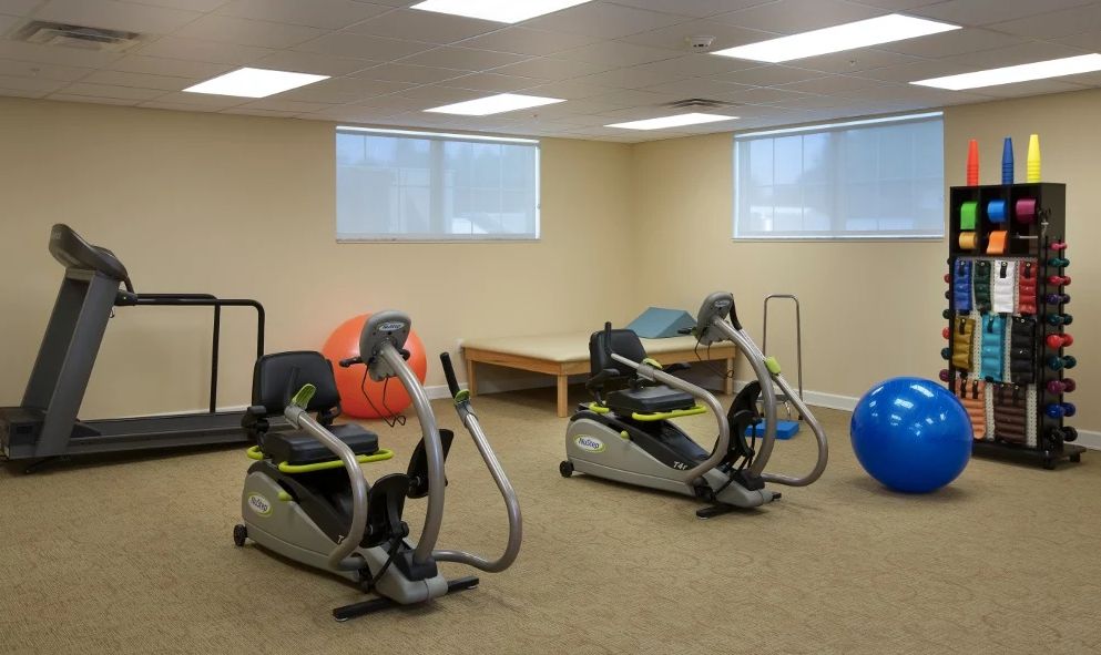 A fitness room with recumbent bikes and exercise equipment.