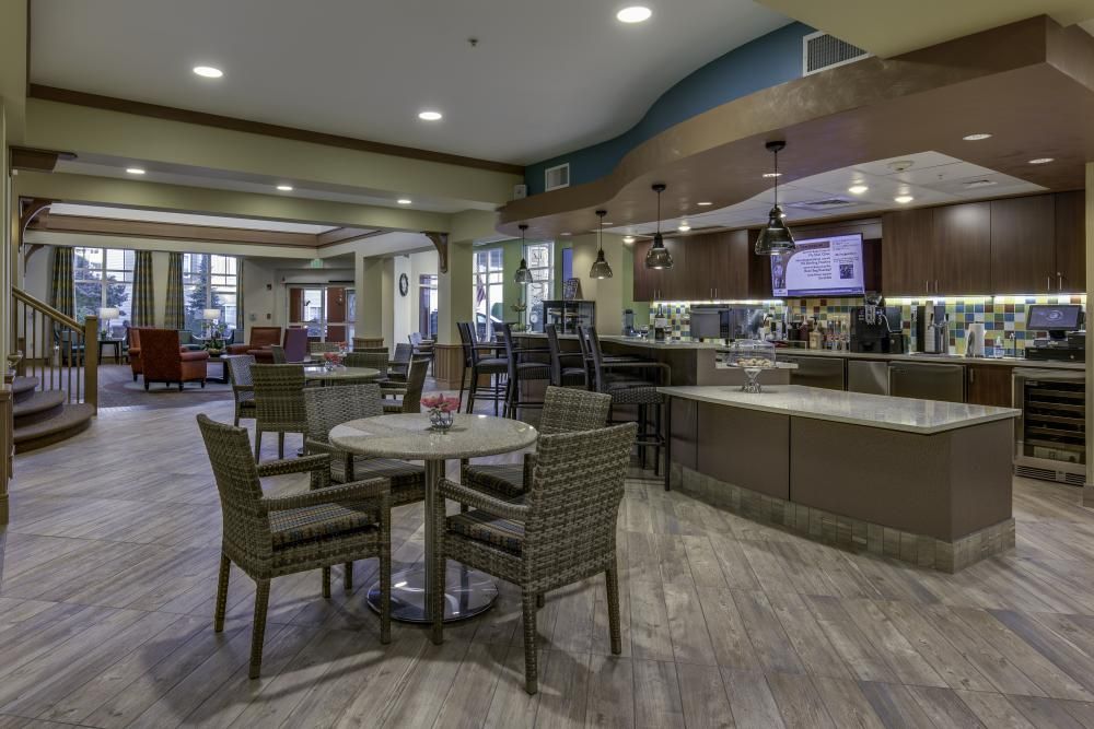 A modern cafe interior with cozy seating and a stylish design.