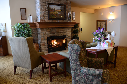 A cozy living room with a welcoming fireplace and comfortable seating.