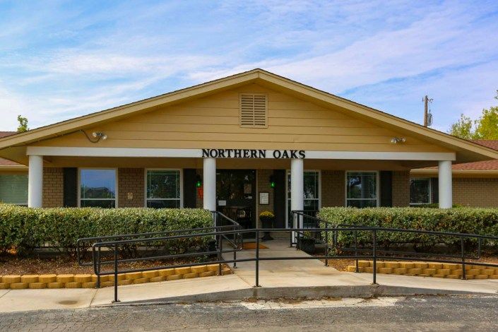 Front view of a bank building with yellow exterior and an entrance sign reading 'Southern Bank'.