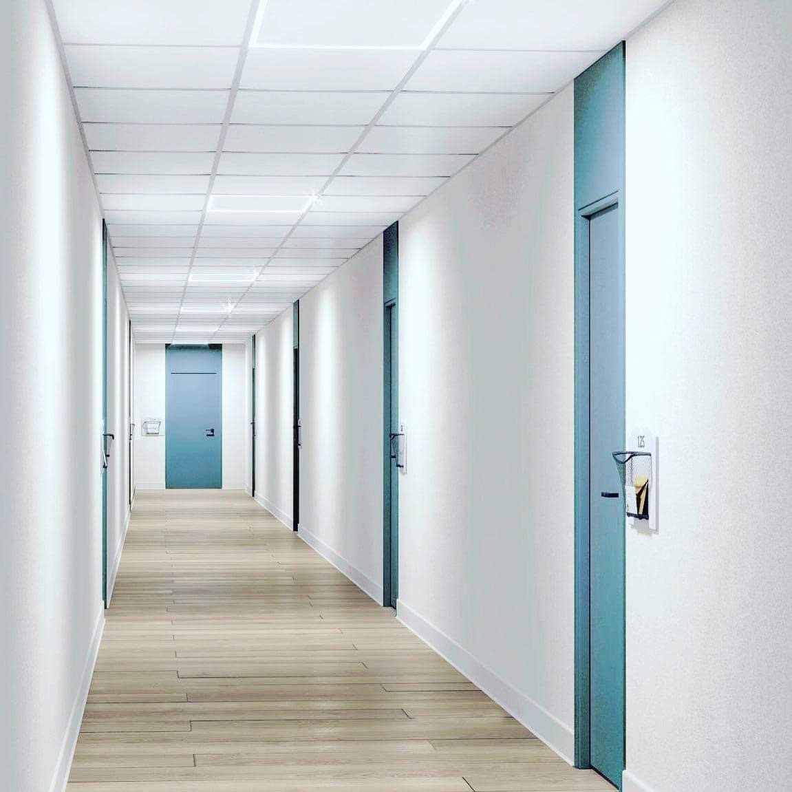A modern corridor with blue doors and a white ceiling.