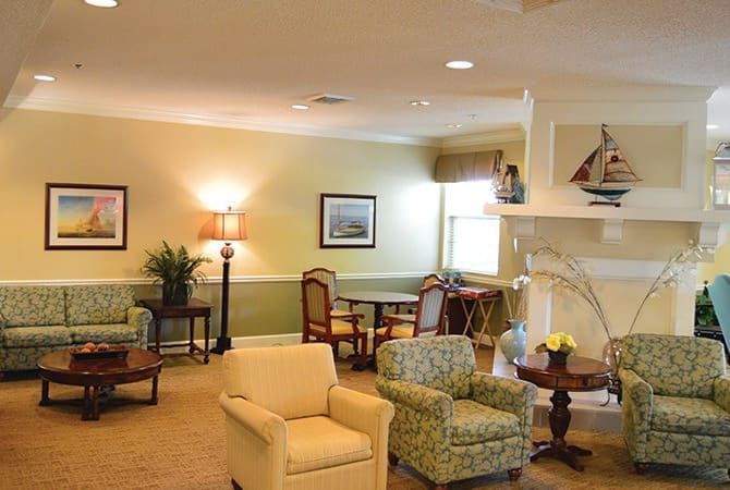 A cozy living room with comfortable armchairs and decorative elements.