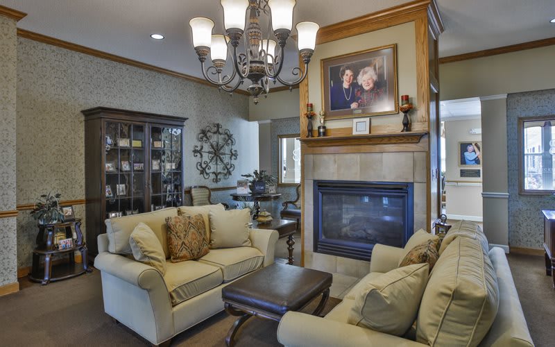 A cozy living room with a fireplace and elegant decor.