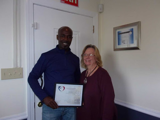 Celebrating an achievement with a certificate presentation.