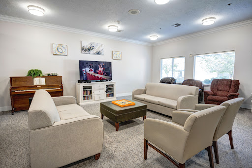 A cozy and inviting living room setup with comfortable sofas, a coffee table, and a television.