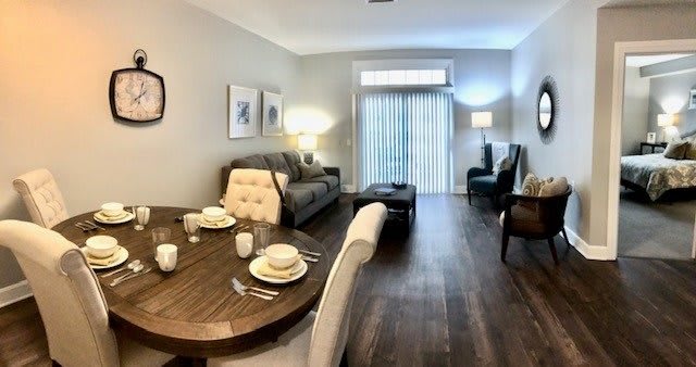 A cozy living and dining area with modern furniture and decor.