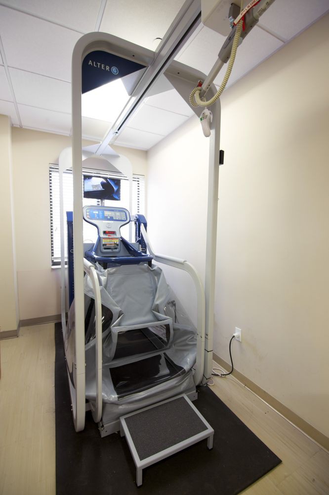 A medical x-ray machine positioned in a hospital room for diagnostic imaging.