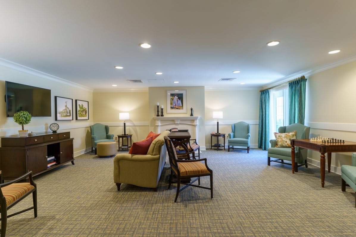 A cozy living room with comfortable seating and soft lighting.