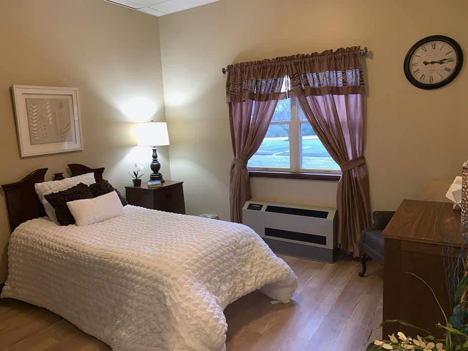 Cozy bedroom with a single bed and wooden furniture.