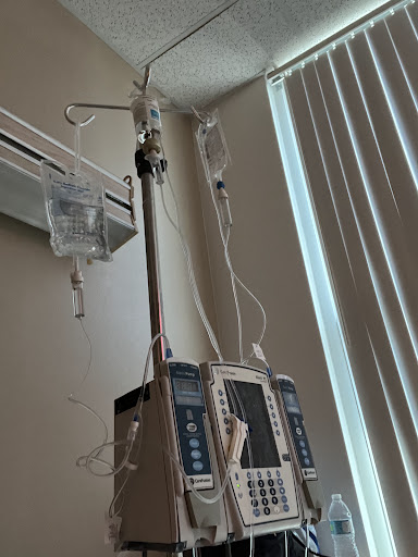 An IV drip setup in a hospital room.