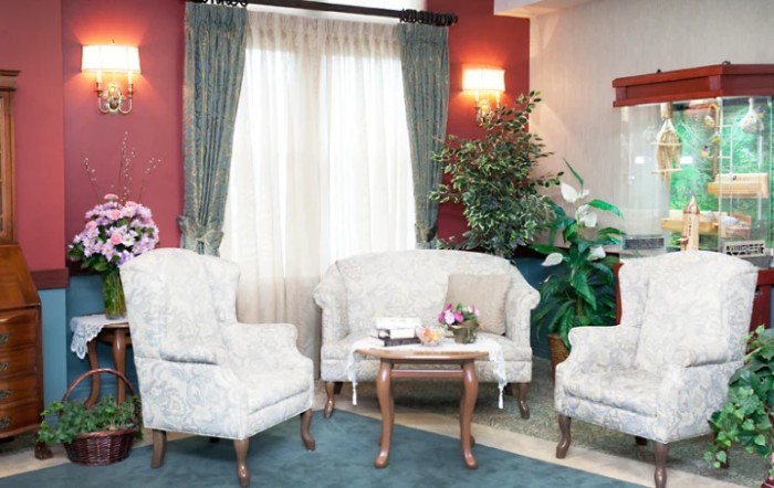 A cozy living room with classic furniture and elegant decor.