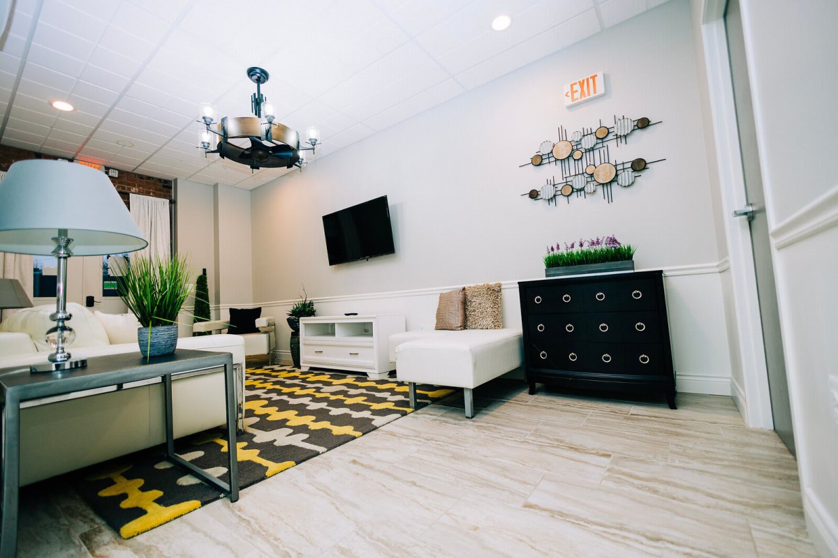 A modern living room with stylish decor and comfortable seating.