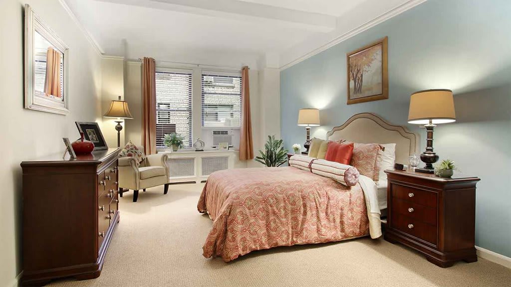 A beautifully decorated bedroom with soft lighting and inviting furnishings.