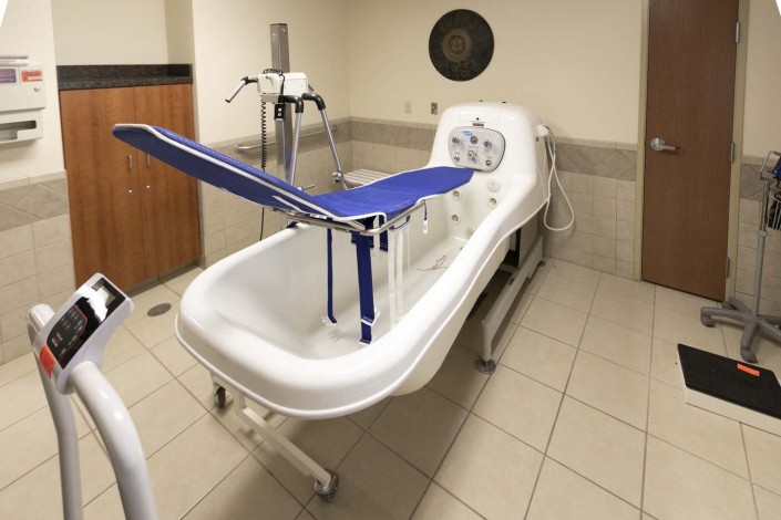 A specialized medical bathtub used in healthcare facilities for patient care.