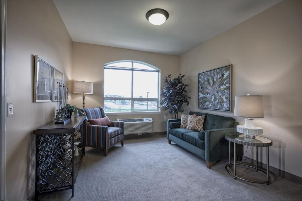 A cozy living room with comfortable seating and elegant decor.