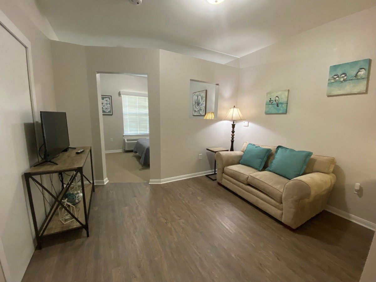 Cozy living room with a comfortable sofa and modern decor.