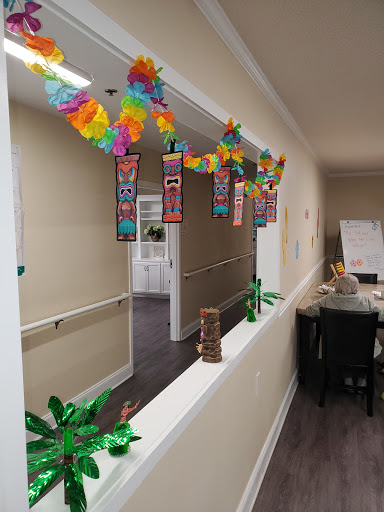 A vibrant indoor space adorned with festive decorations and plants, creating a cheerful atmosphere.