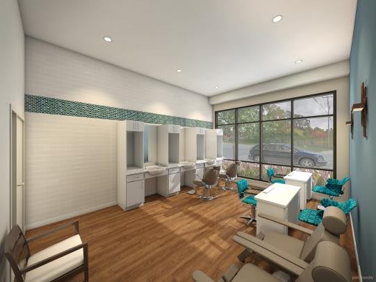 A modern salon interior with styling stations, comfortable chairs, and large windows allowing natural light.