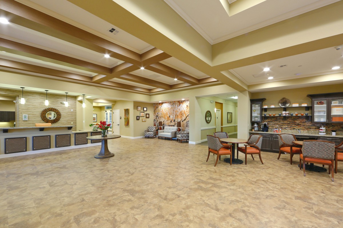 A spacious and elegantly designed lobby with modern furnishings and warm lighting.