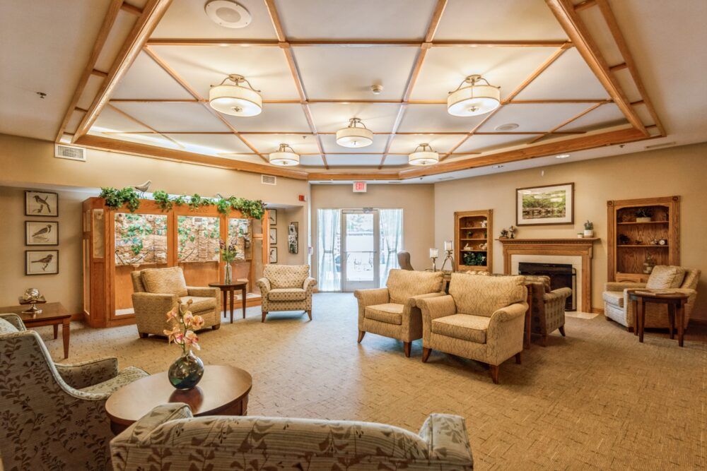 A cozy and spacious living room interior with comfortable seating and elegant decor.