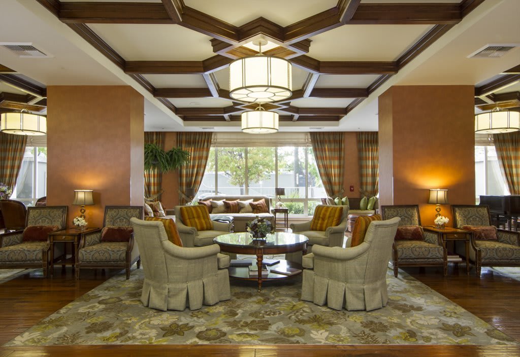 A luxurious living room with elegant furniture and warm lighting.