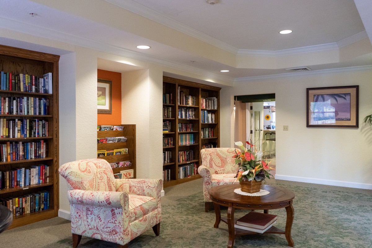 Cozy reading area with bookshelves and comfortable seating.