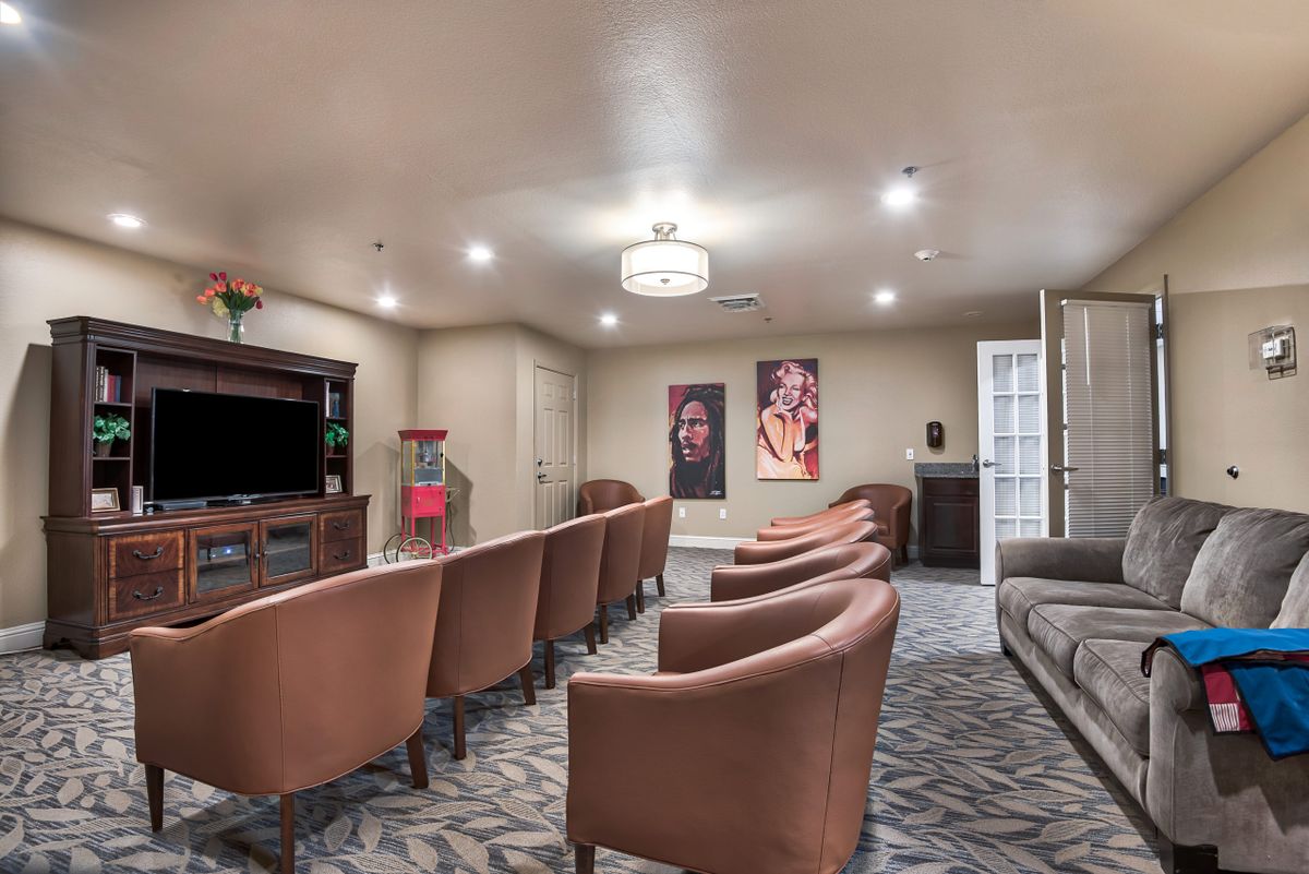 A cozy home theater room with comfortable seating and stylish decor.