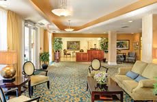 A luxurious lobby featuring elegant seating and a reception desk.