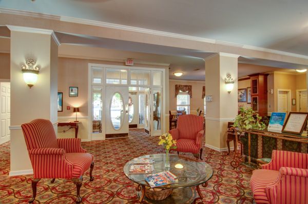 A cozy hotel lobby with classic decor and comfortable seating.