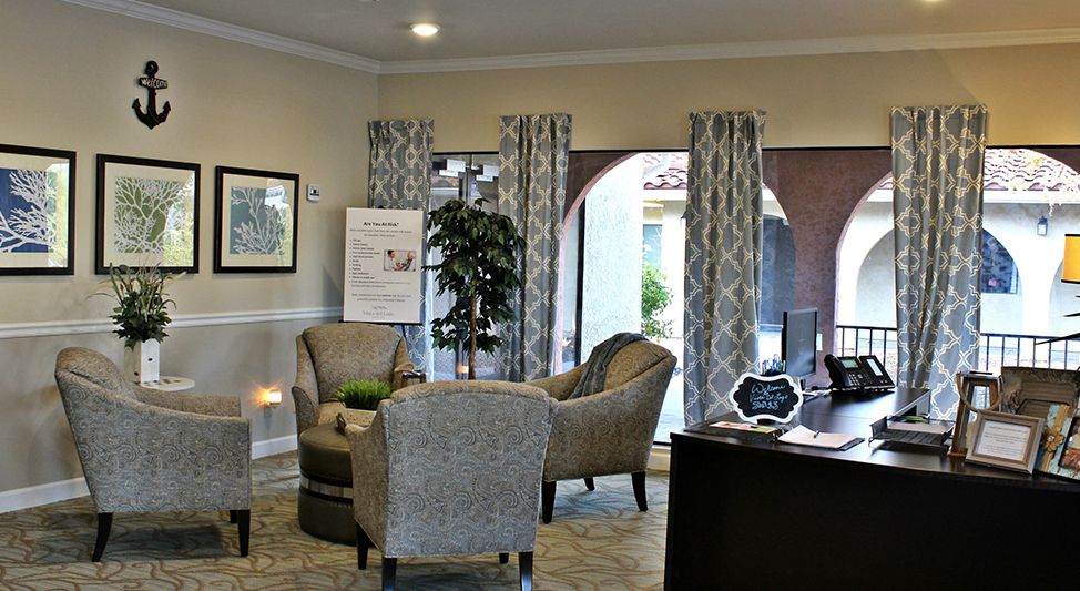 A cozy lobby area with comfortable seating and natural light.