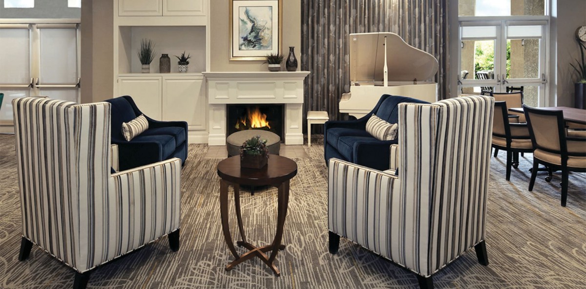 A cozy living room with a warm fireplace and stylish furniture.