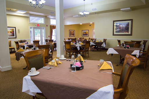 A well-arranged dining space featuring neatly set tables and a warm atmosphere.